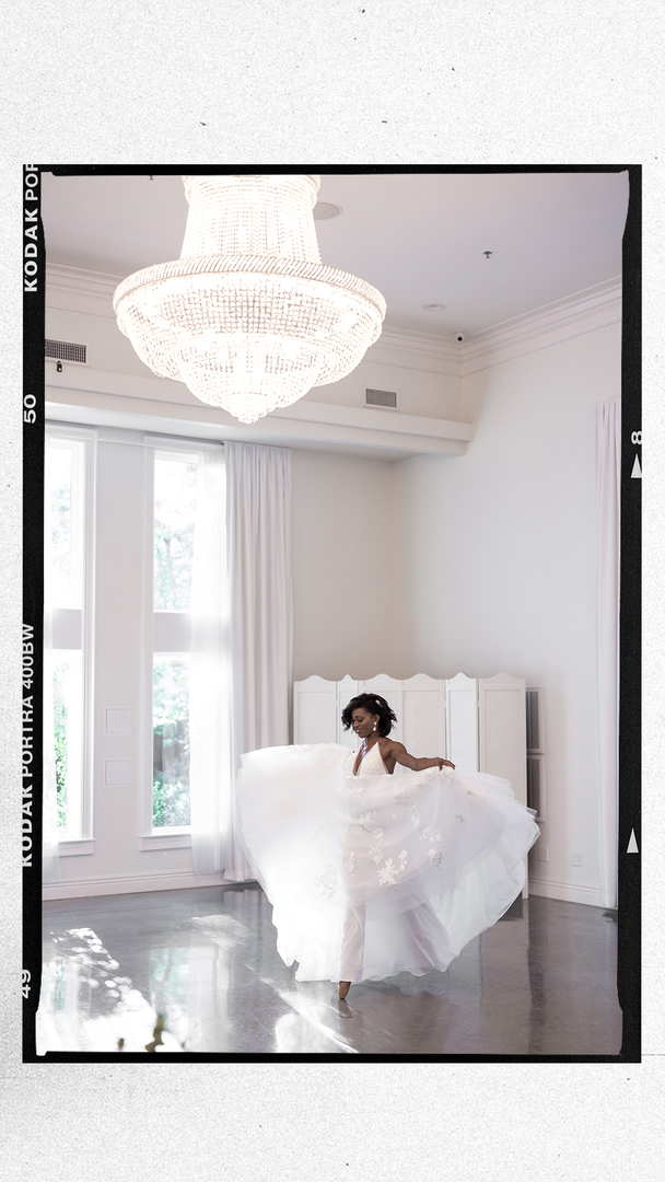 dancing ballerina bride in a white ballroom