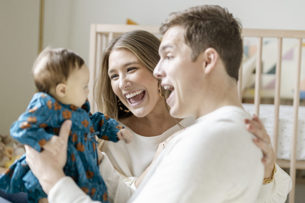 intimate family portraits of a mother, father, and newborn baby