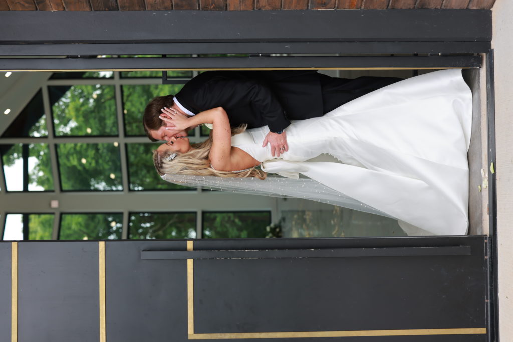 Wedding at Osage House portrait of bride and groom kissing