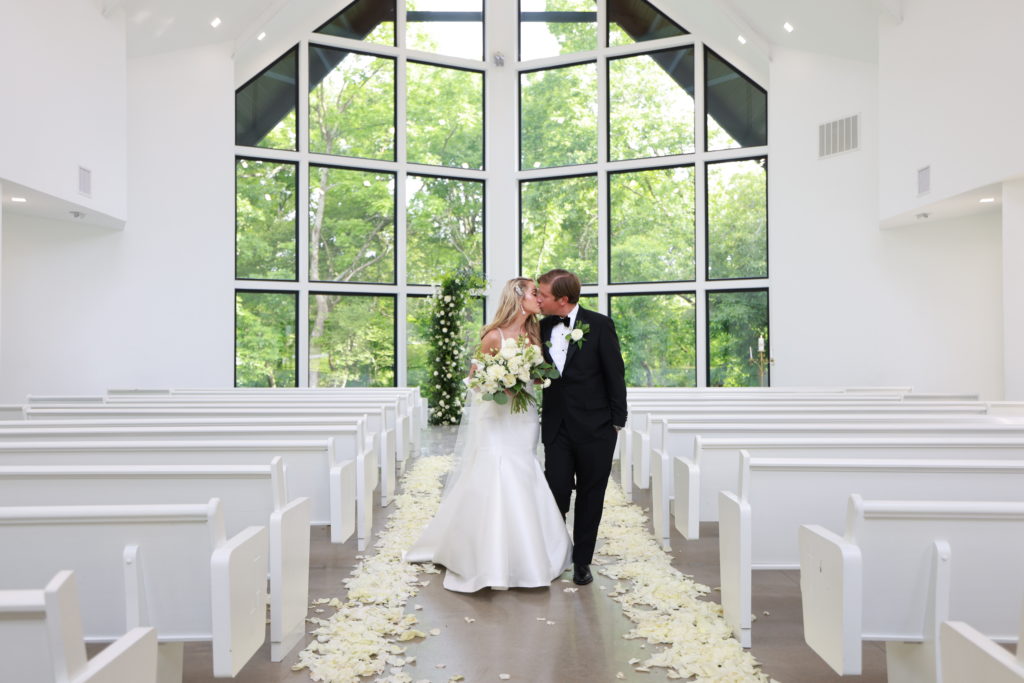 Osage House Real Wedding couple kissing in the chapel