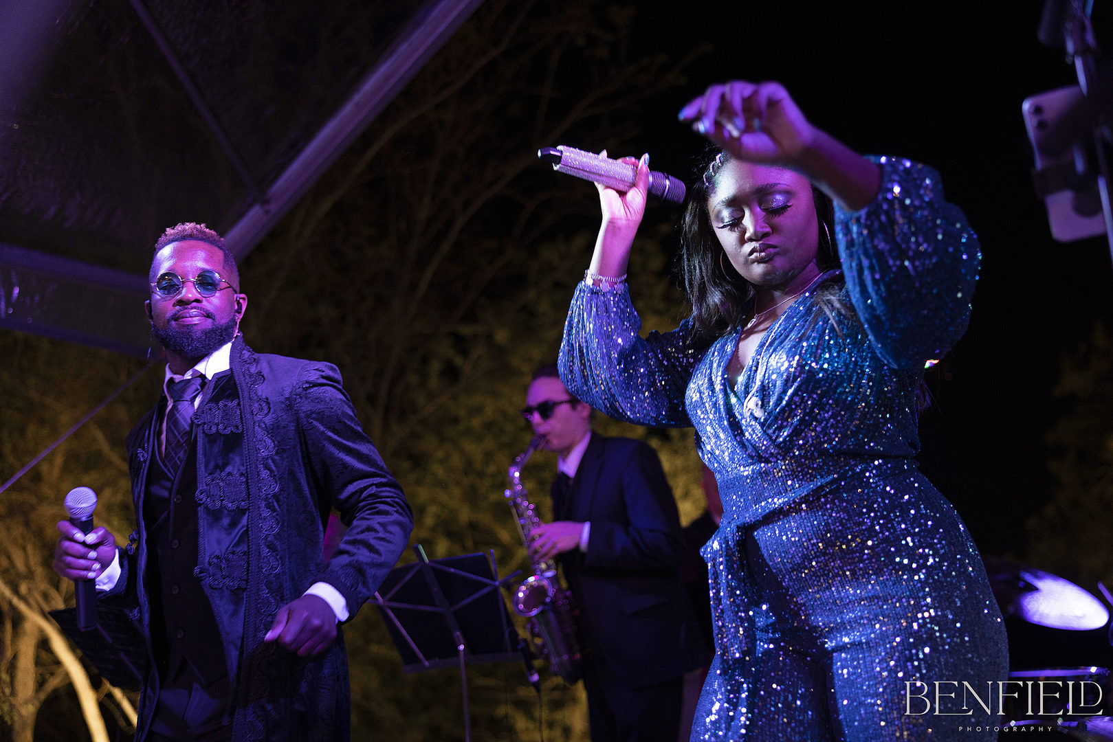 Jordan Kahn Music Company performs a song on stage at the Hillside Estate wedding reception.