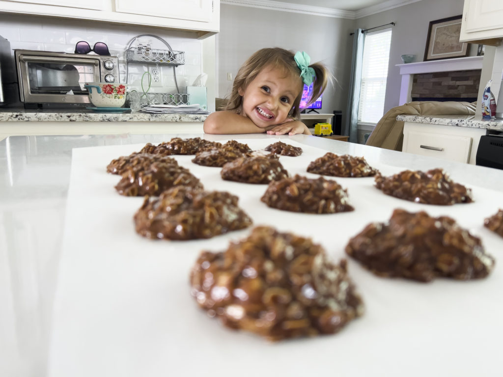 2 year old Scout posing with the pb no bake cookie recipe cookies at her nana's house