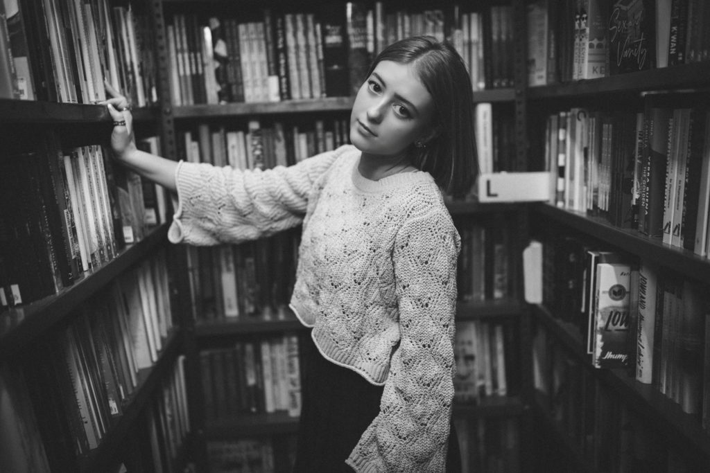 Senior Photos in a Bookstore in black and white