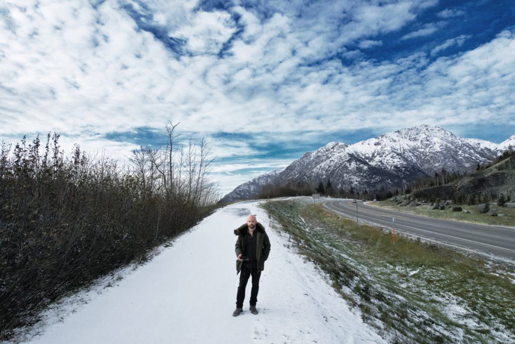 Dale Benfield, luxury wedding photographer, posing in Alaska