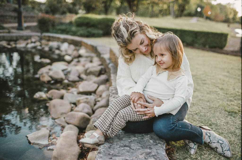 Happy birthday Scout! Here is scout spending quality time with her mom sitting on a rock next to a pond.