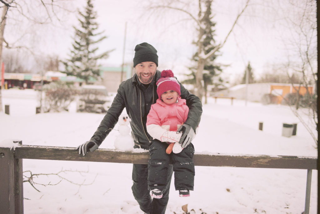 Scout + Dada on film in the snow in Alaska