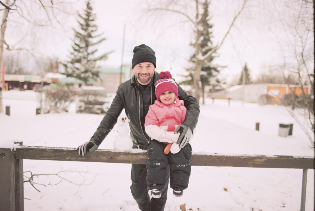 Scout + Dada on film in the snow in Alaska