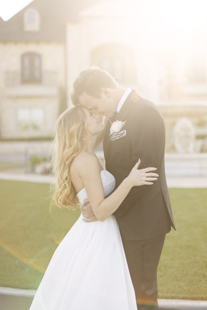 Cortlyn's wedding at Knotting Hill Place outside Dallas, TX, with golden hour sunlight for her sunset wedding portraits with her groom