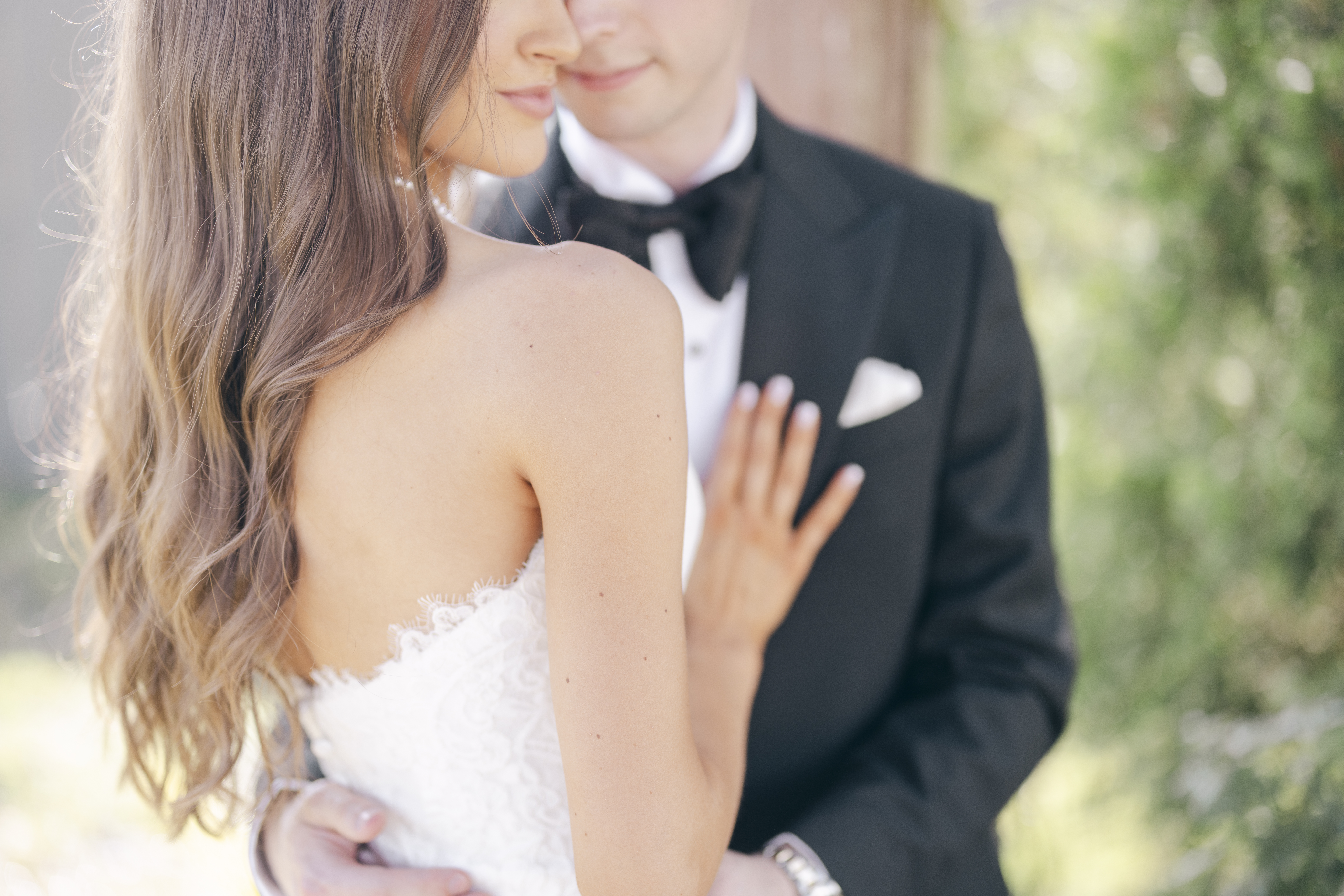 luxury wedding photography of a classic bride and groom hugging on their wedding day