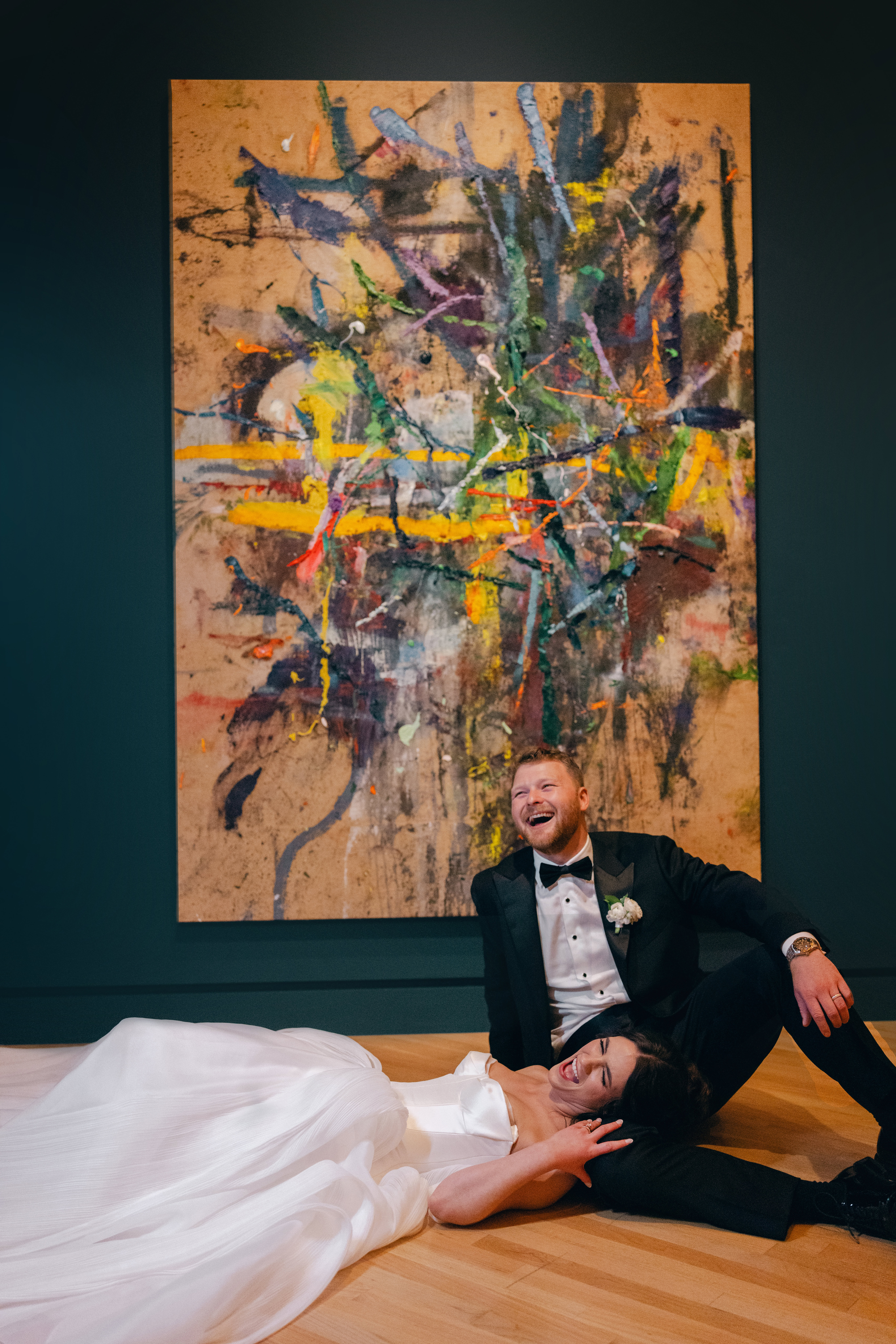 Bride and groom wedding portrait surrounded by art at their Crystal Bridges wedding.