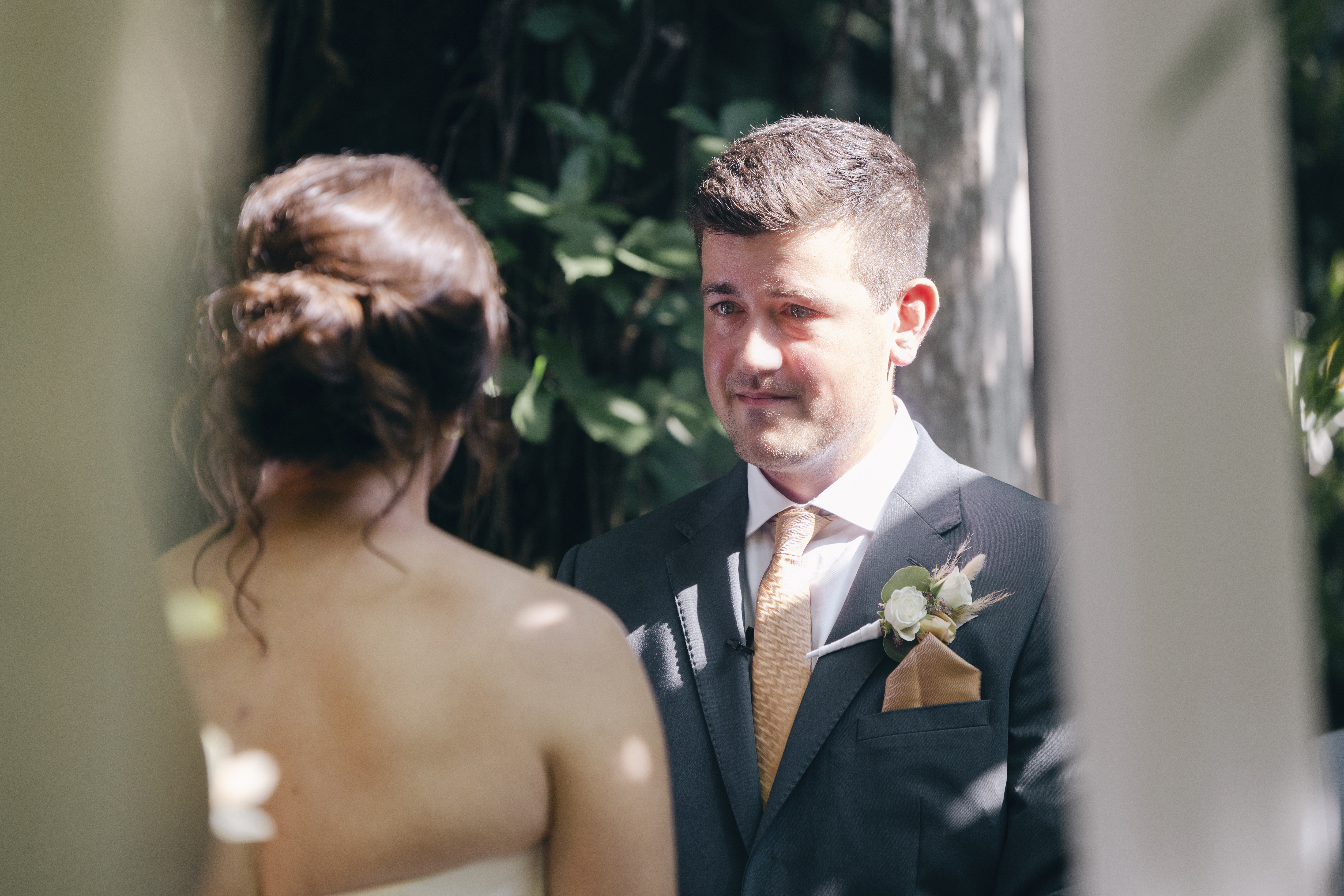 The groom cries as he sees his bride for their Fayetteville Garden Room wedding.