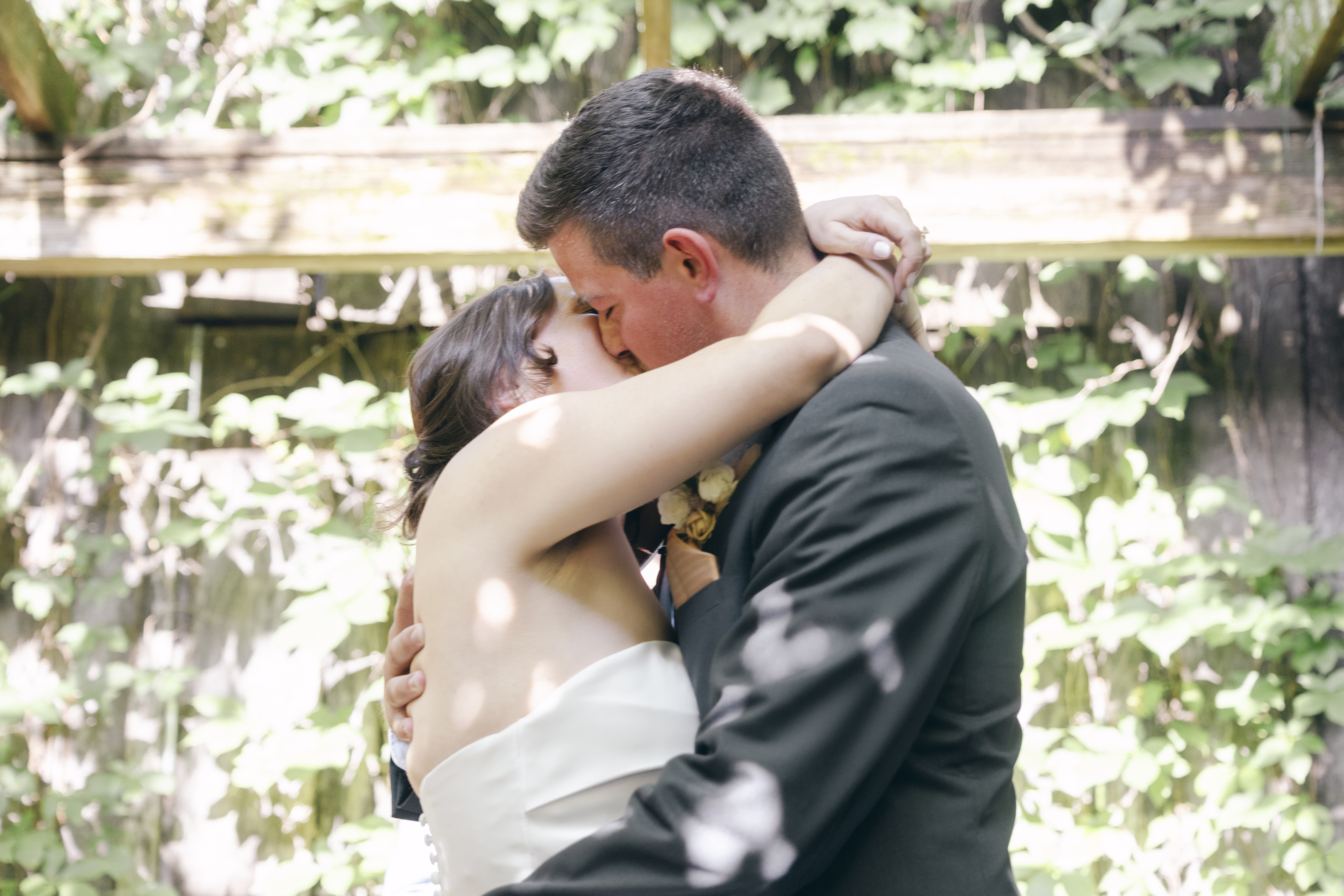 Bride and groom share their first kiss as husband and wife during their Fayetteville Garden Room wedding