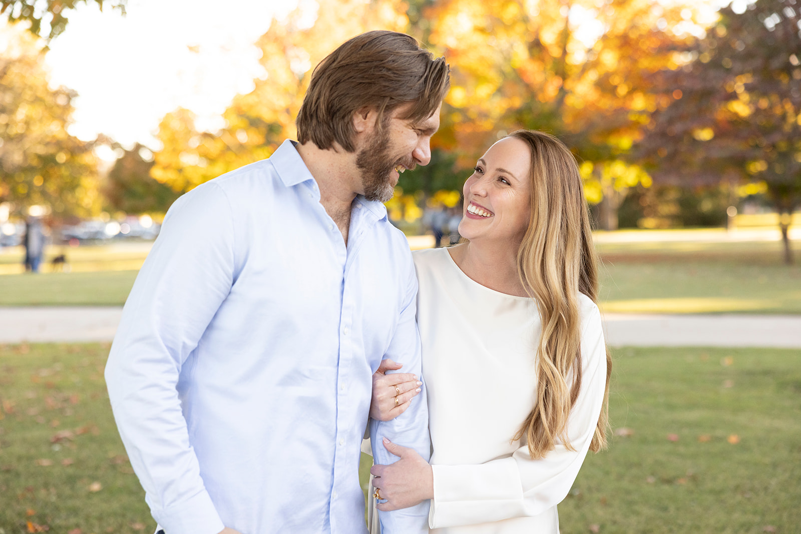 Fall engagement photos in Fayetteville Arkansas with colorful autumn trees