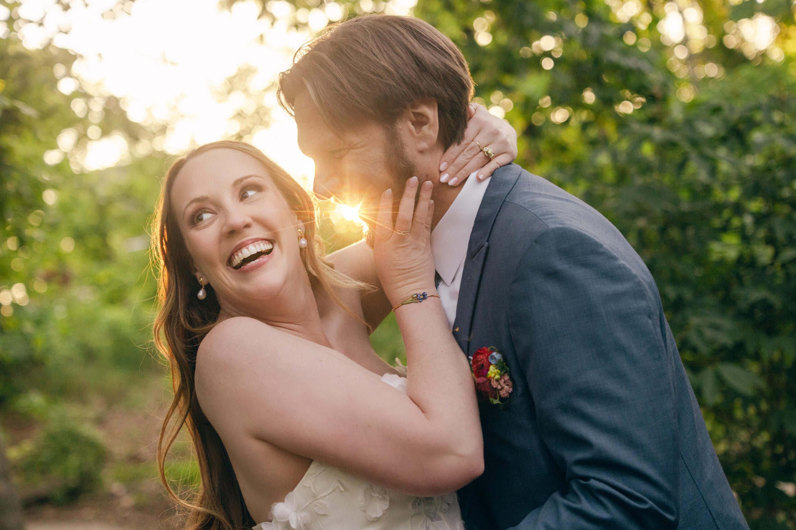 Golden hour wedding portrait with sun flare at Bentonville garden wedding