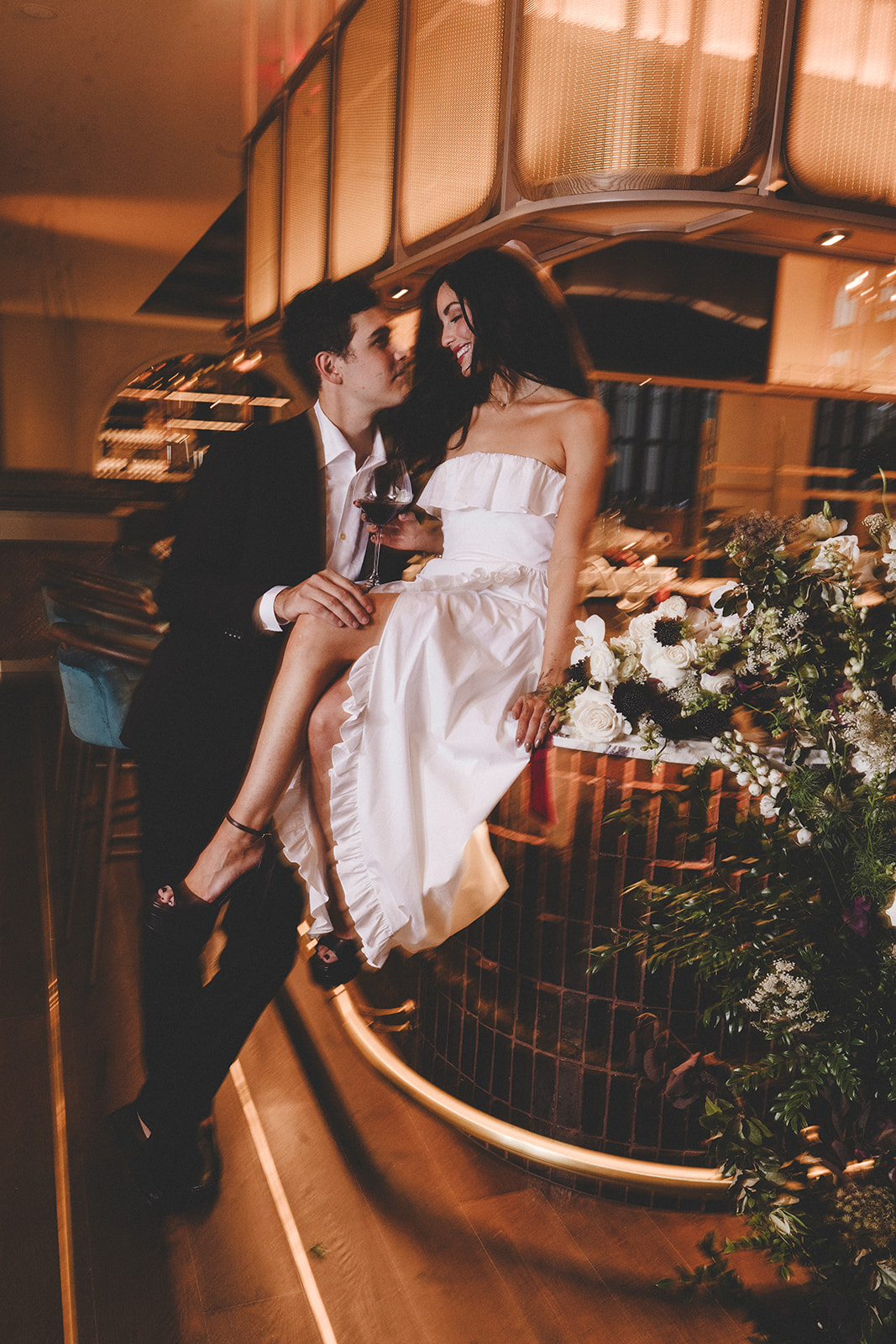 Bride and groom sharing a romantic moment at the lobby bar inside Hotel Vin Rogers.