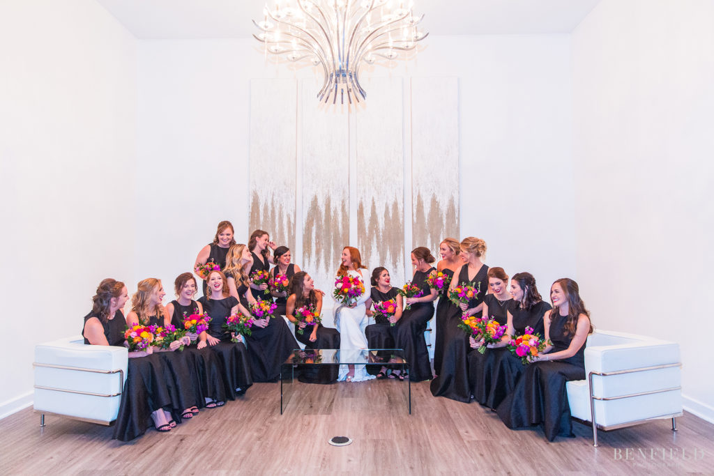 a fun wedding party bridesmaid picture at the event space gallery in kansas city in the power and light district