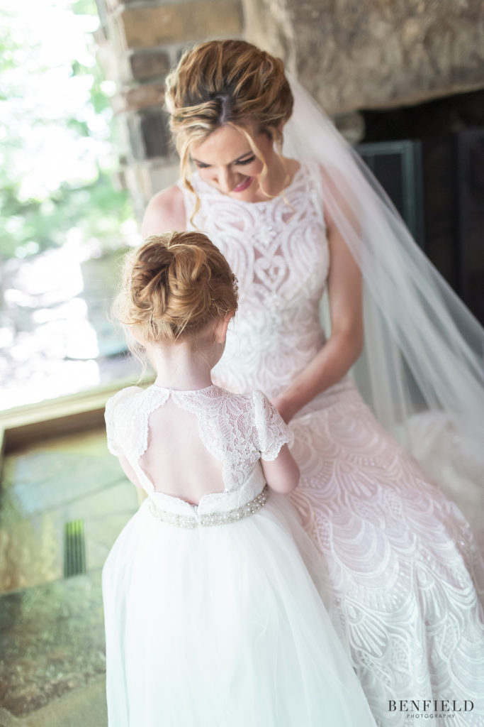 sweet moment with bride and her adorable flower girl