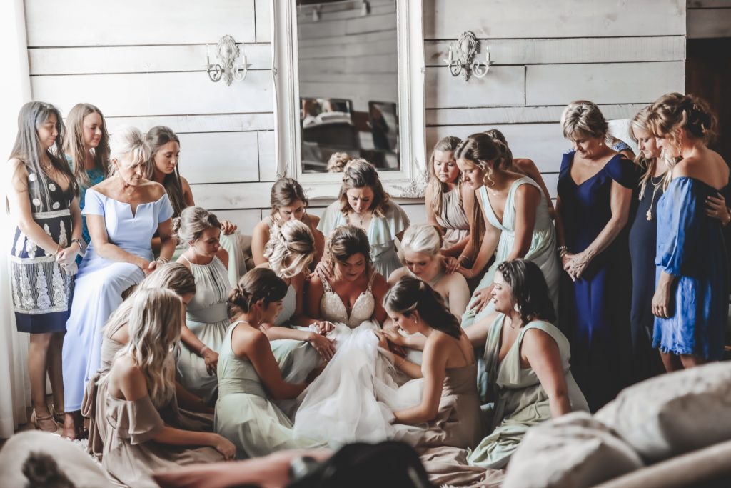 praying with bridesmaids and bride - emotional moment with bridesmaids