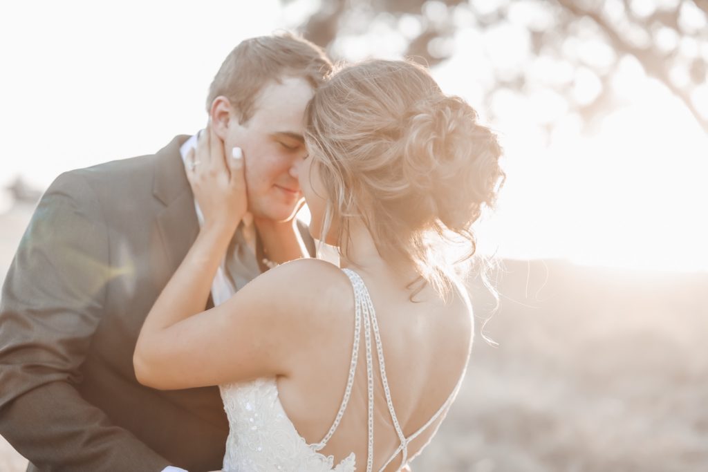 beautiful sunset portraits during golden hour with bride and groom