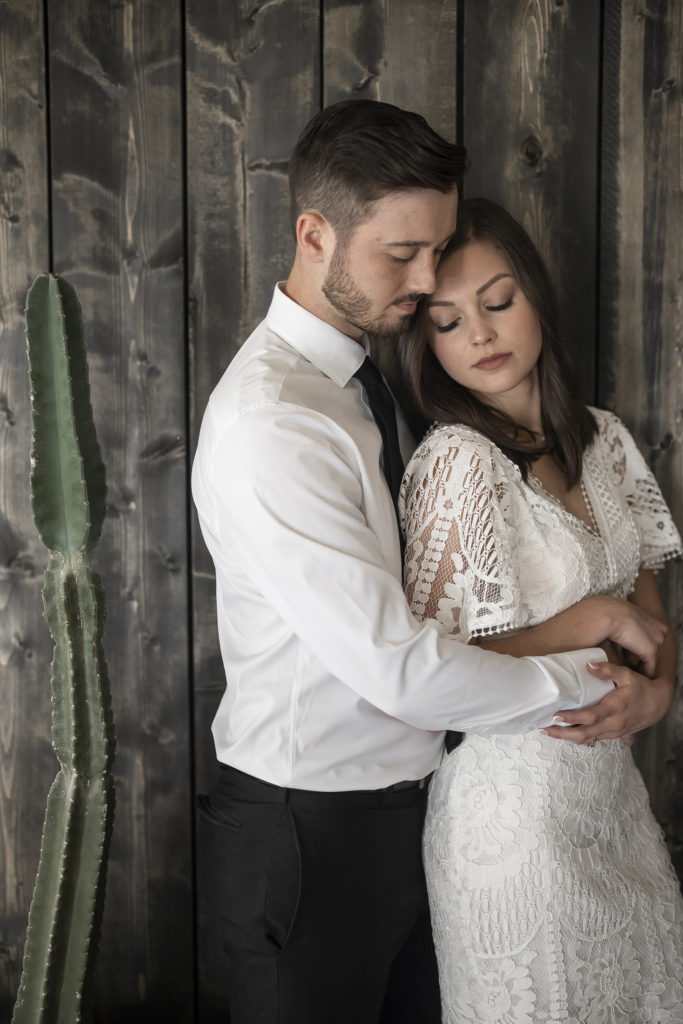 bride and groom with cactus