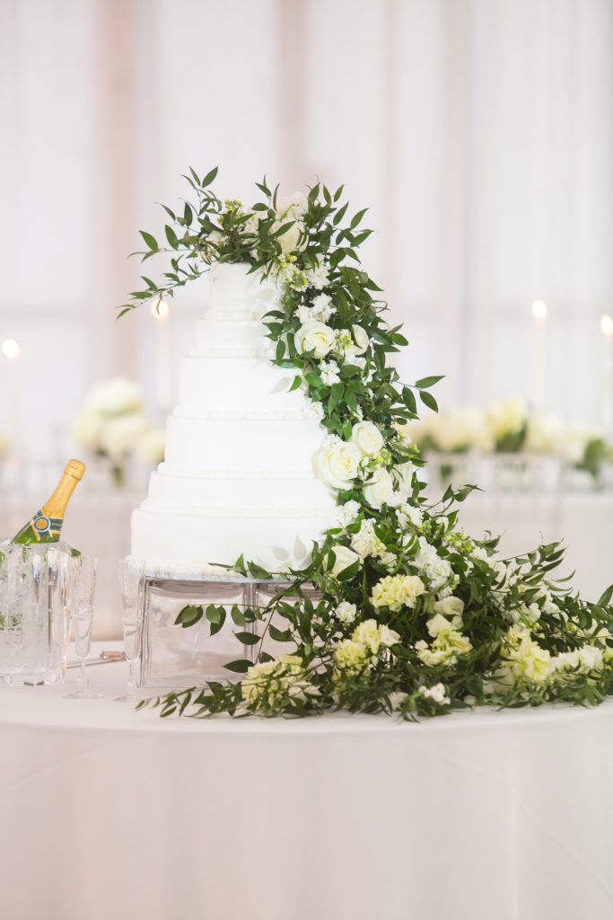 Cascading green and white florals make this 6-tier wedding cake divine in this Best Wedding cake nominee.