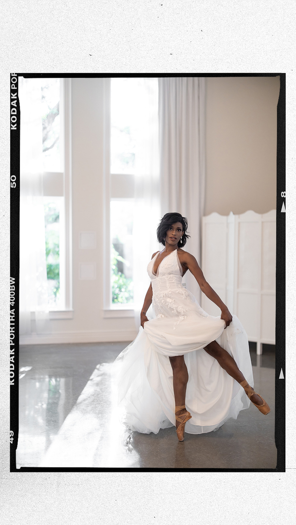 Black bride in ballet shoes in a large white ballroom