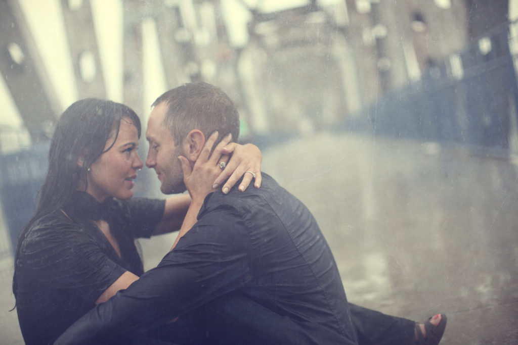 Bride and groom's engagement portrait in the rain. 