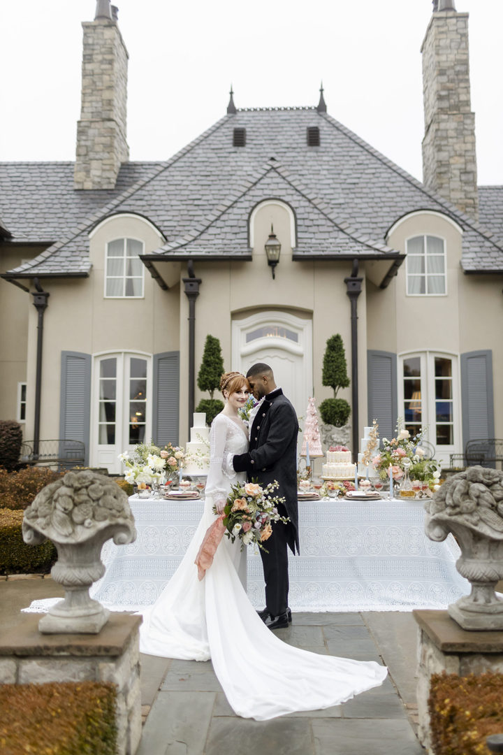 Bridgerton Style Wedding with black groom and redhead bride outside of a gorgeous mansion