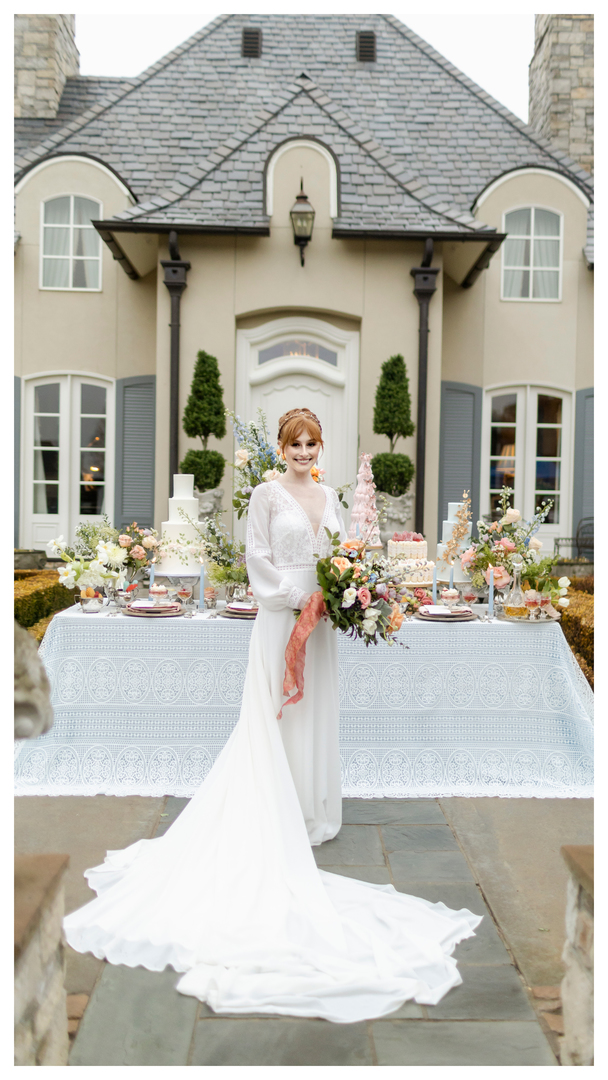 Gorgeous bridal wedding portrait of red-headed bride in front of a mansion inspired by Bridgerton on Netflix