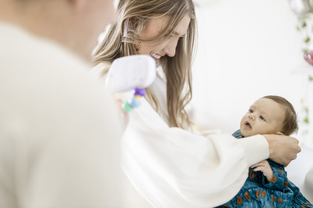intimate family portraits of a mother, father, and newborn baby