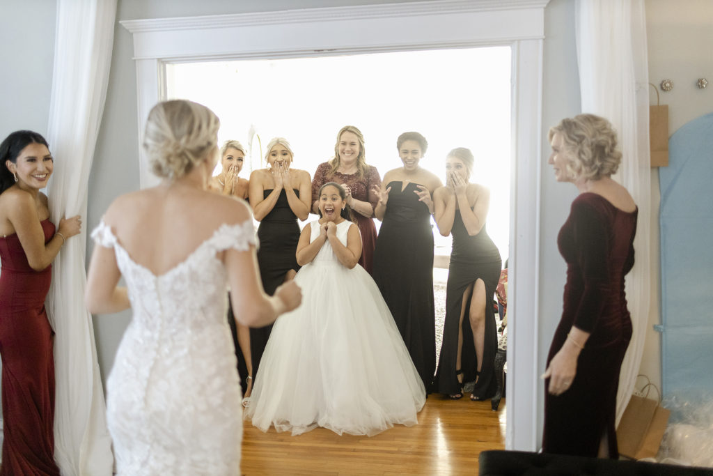 first look with bride and bridesmaids and flower girl