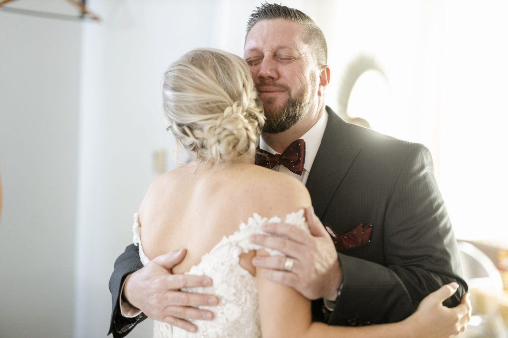 Dad cries during first look with his bride daughter at wedding at I Street Ballroom in Bentonville