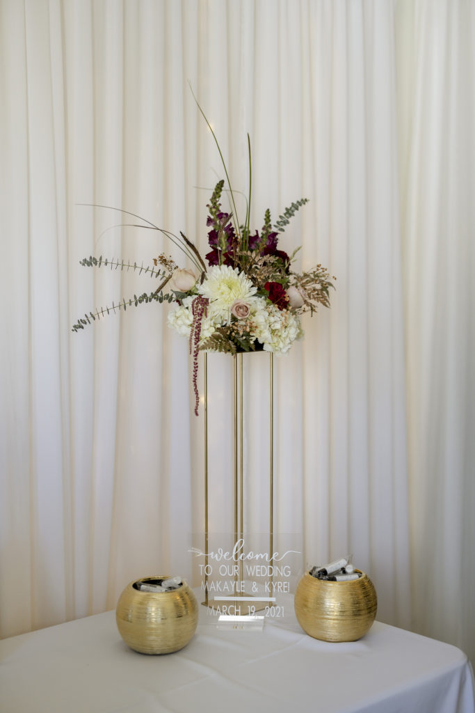 Floral arrangement for welcome table at wedding ceremony