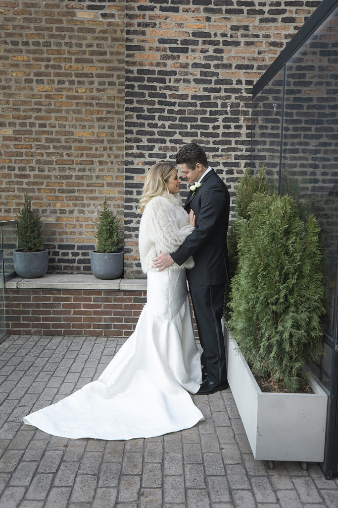 Chicago Athletic Association Wedding of the bride and groom during their photo shoot on Cindy's Rooftop