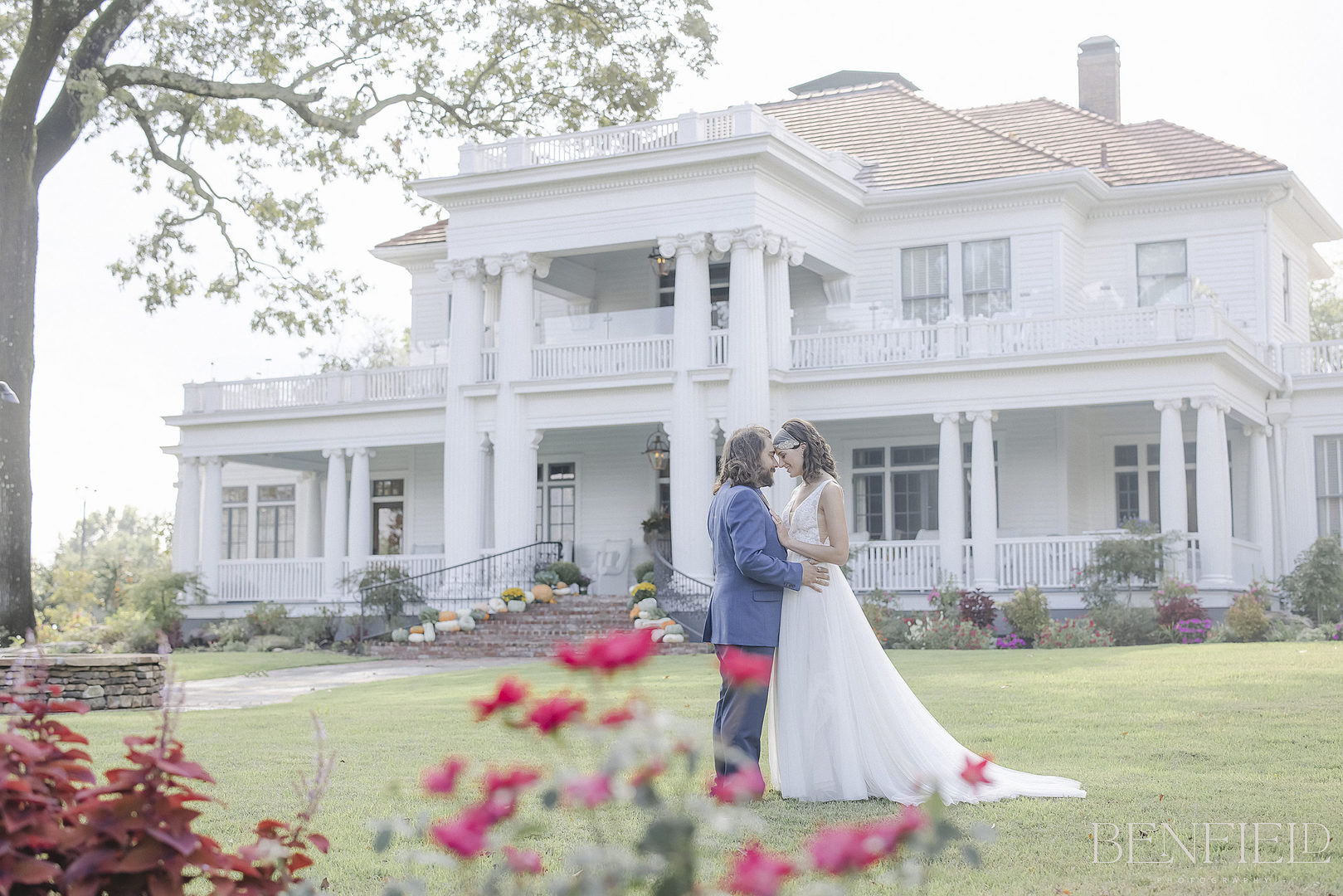 Wedding at The Reserve in Hot Springs shows the bride and groom in front of the mansion