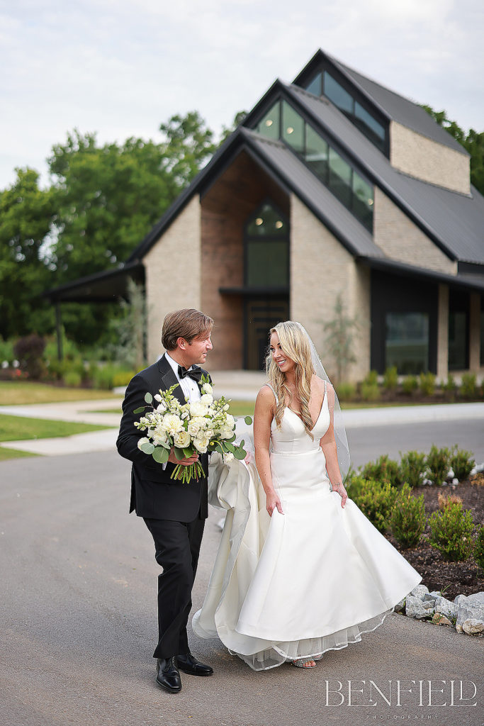 Bride and Groom walking outside the Osage Chapel for their Weddings at Osage House