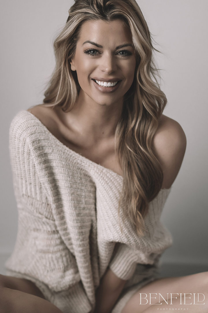 NWA Model wearing only a loose sweater off the shoulder (wearing no pants)
