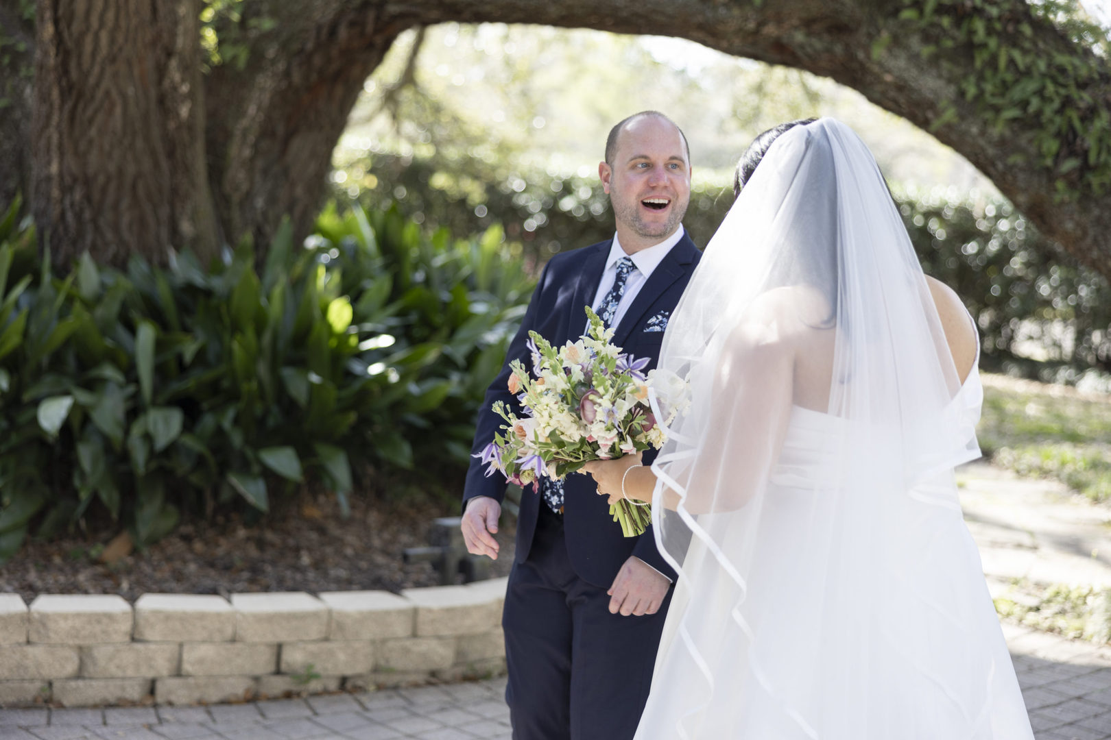 First look of the bride and groom at their Vintage Court Real Wedding in Covington LA