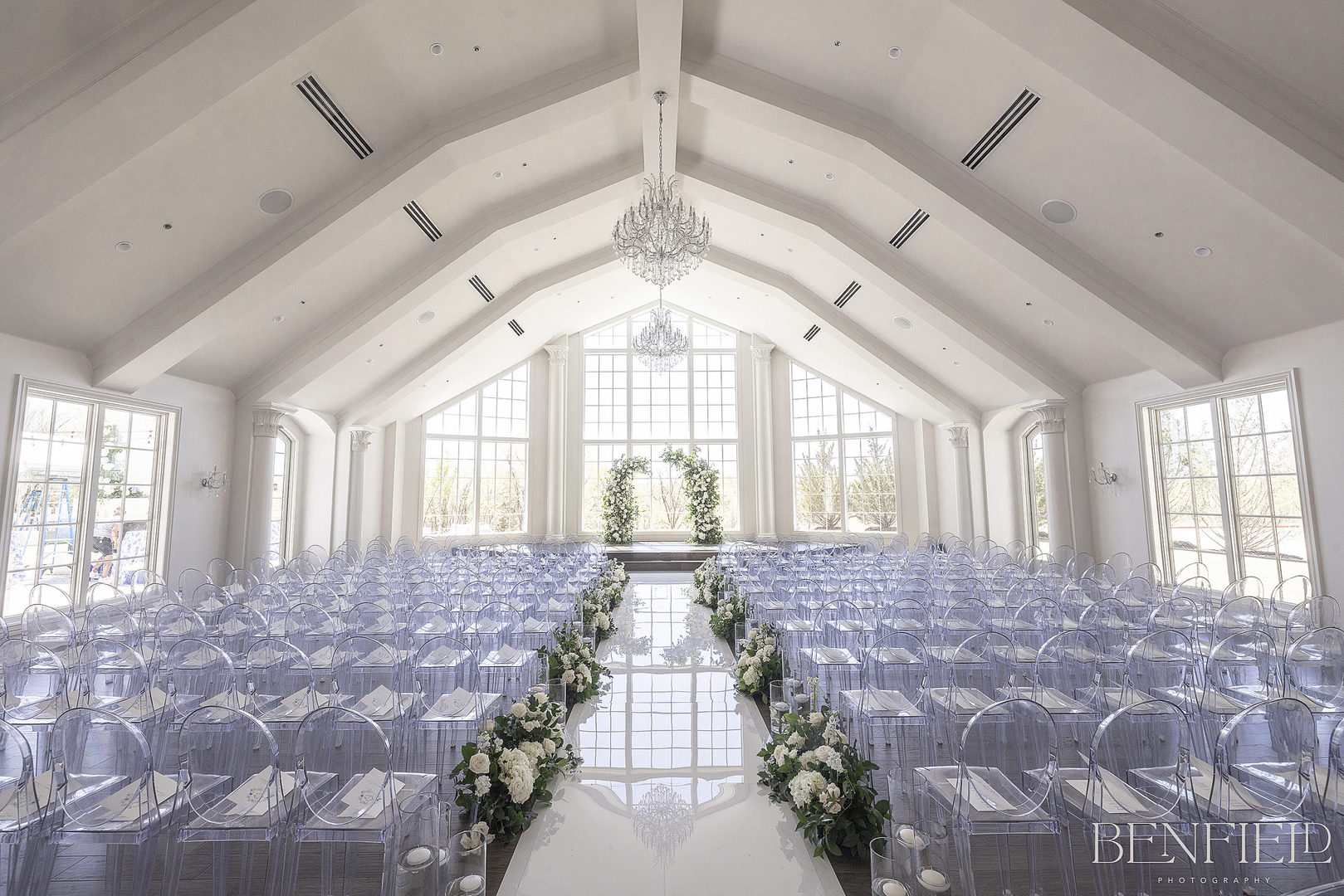 Hillside Estate Wedding Chapel is all white with tons of natural light and acrylic "ghost" chairs.