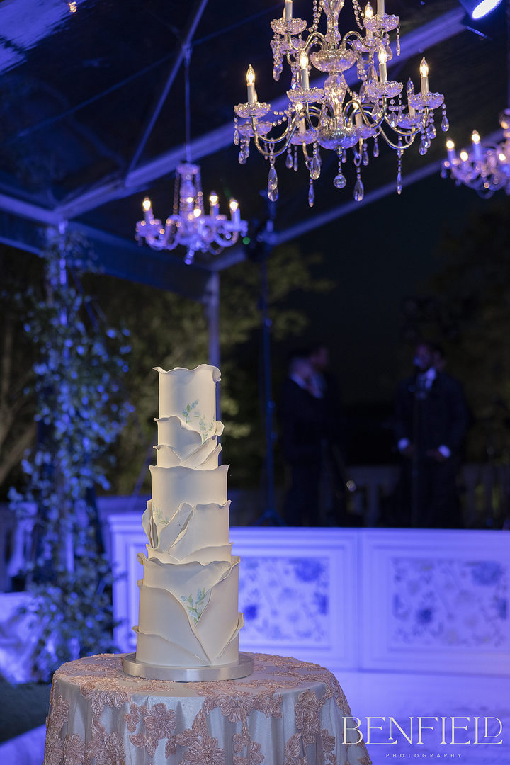 Four tier wedding cake resembling the bride's wedding gown 