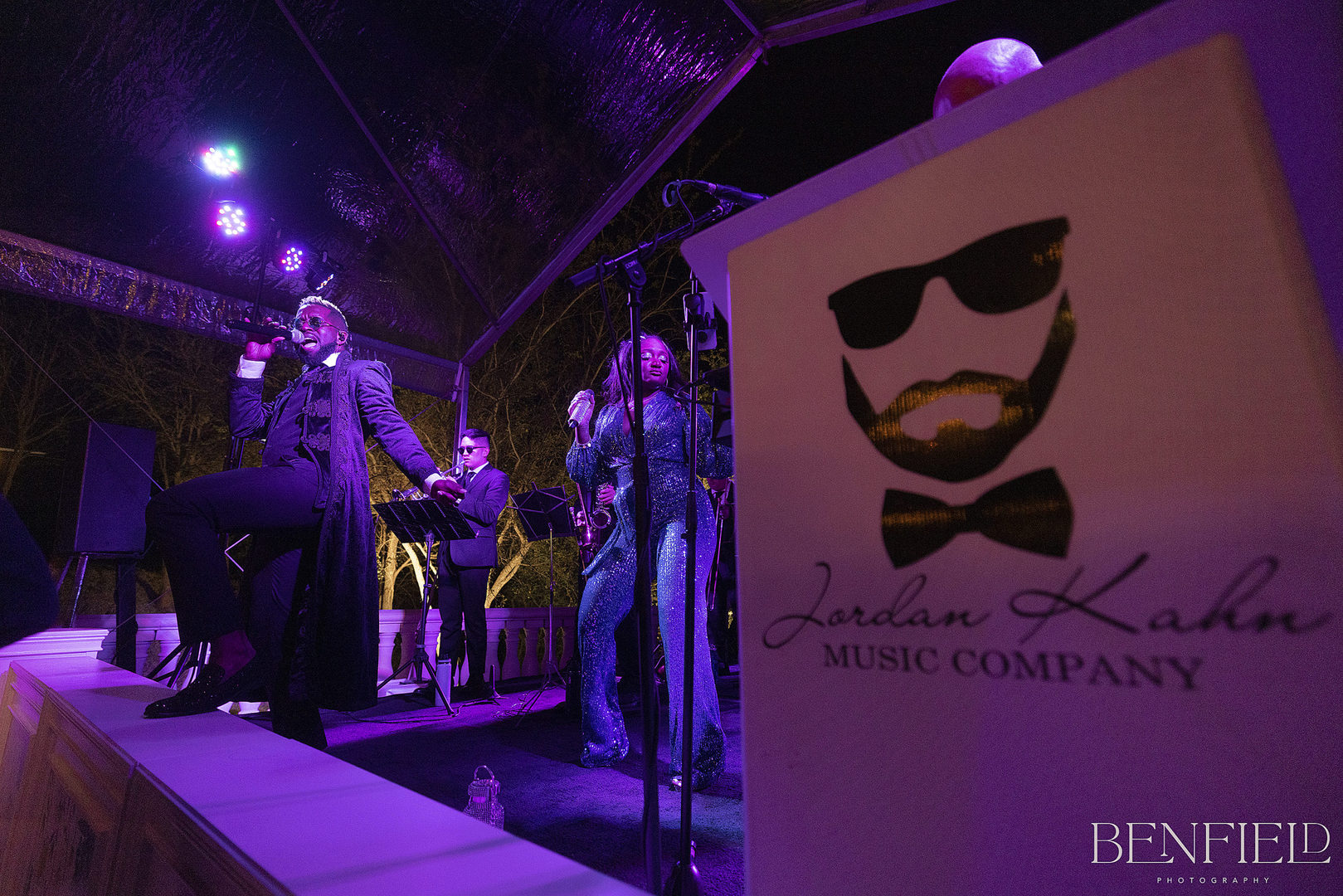 Jordan Kahn Music Company performs a song on stage at the Hillside Estate wedding reception.