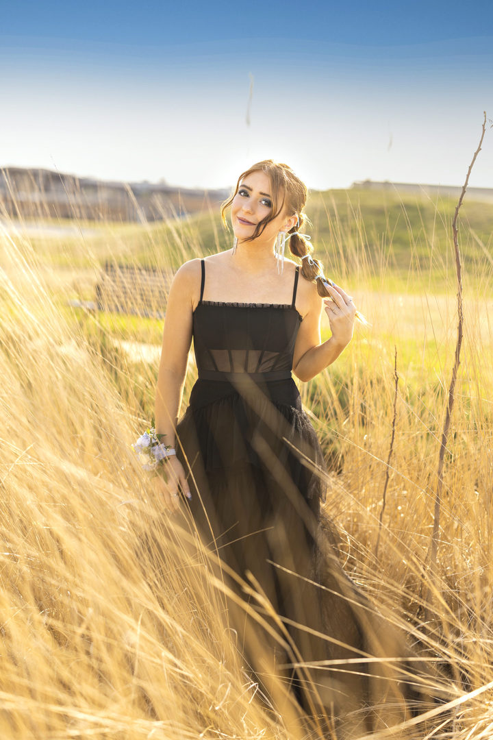 Prom night portraits of redhead daughter in a wheat field