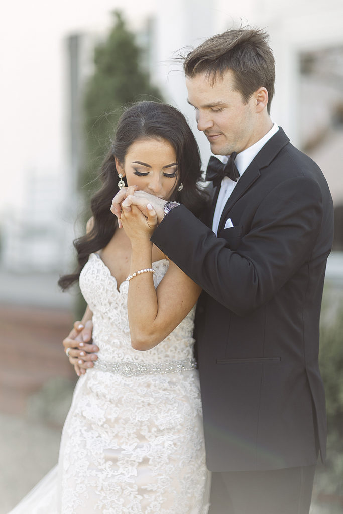 where to buy a groom's tux, as shown here when the bride is kissing the grooms hand