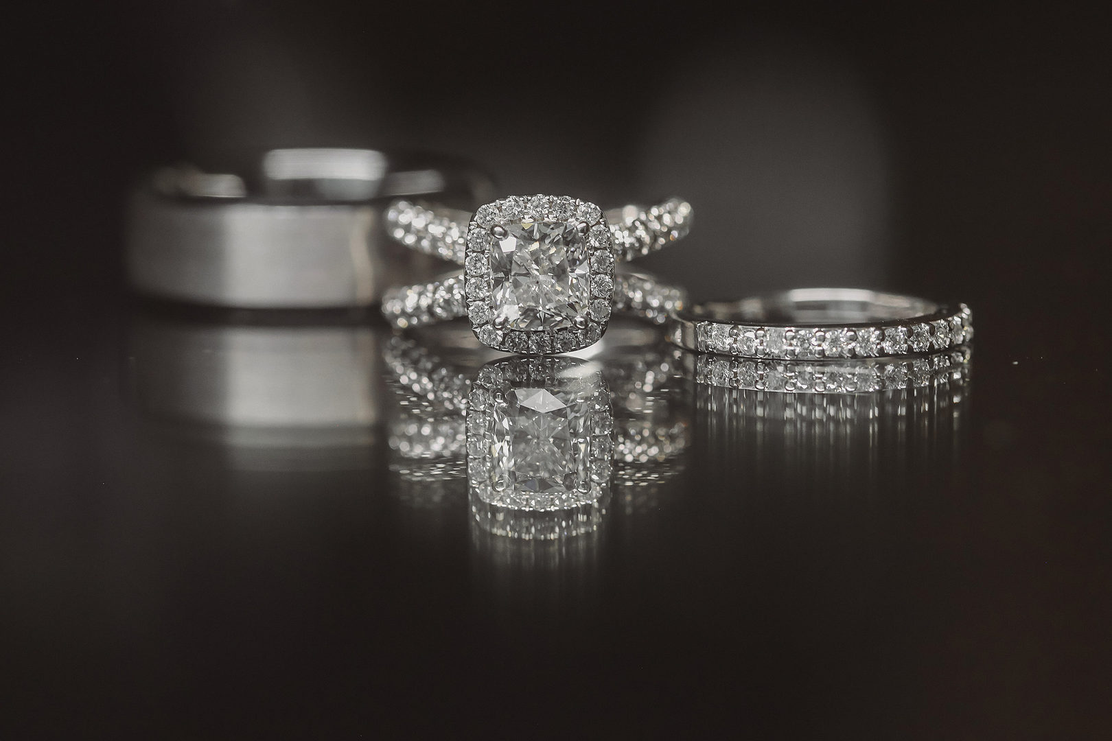 luxury wedding rings in dark lighting