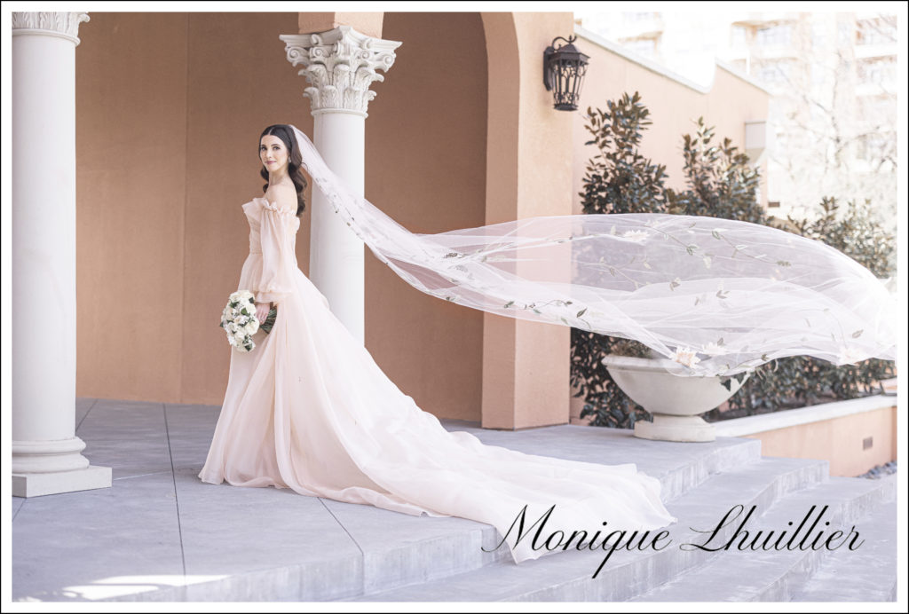 Vogue Bridal Photographer shoots stunning brunette bride in blush pink wedding dress from Monique Lhuillier