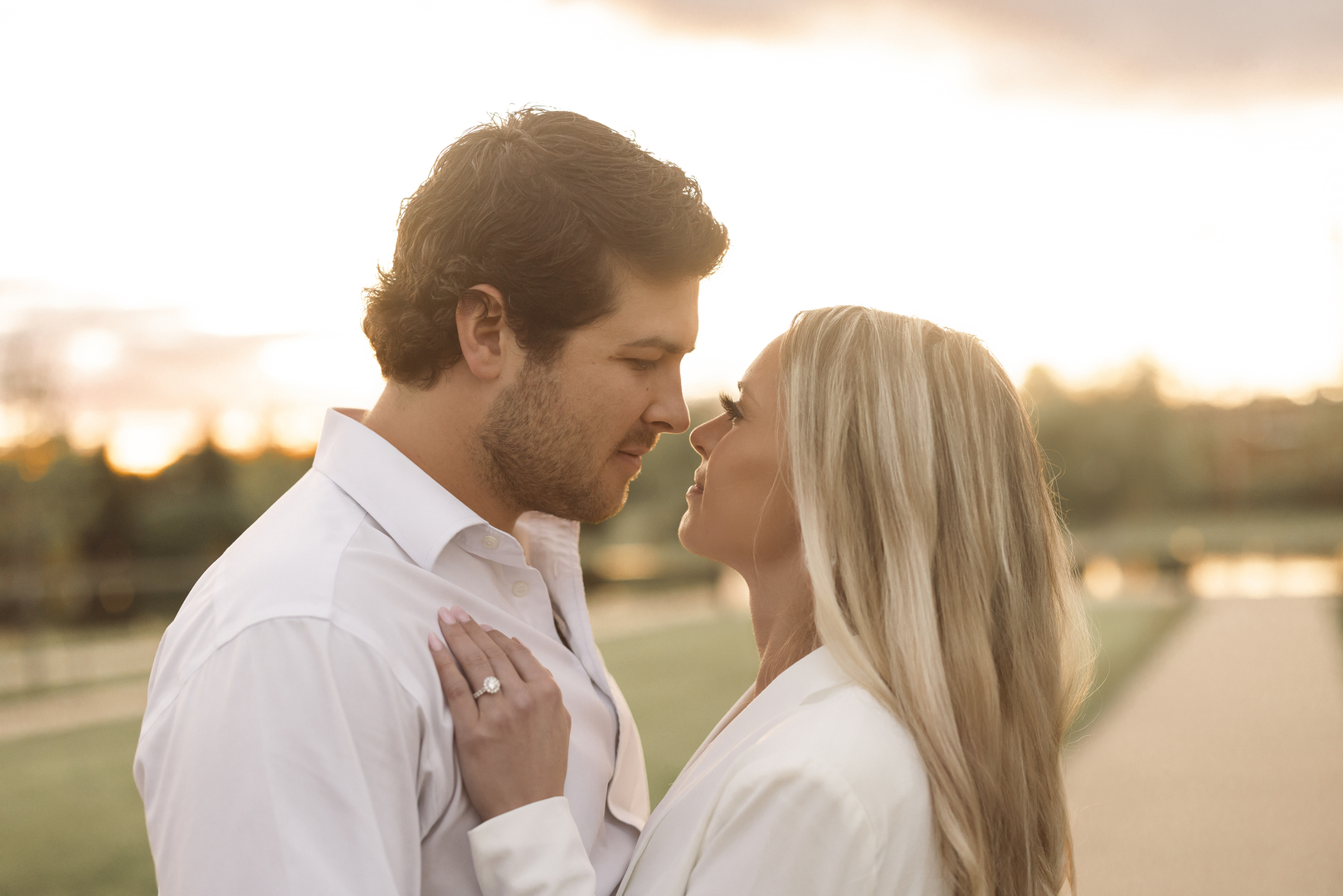 sunset portraits for young couple's engagement photos in bentonville