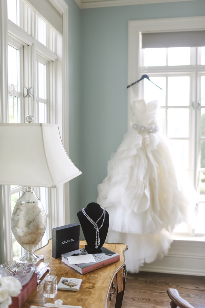 Luxury Estate Wedding Photography setup with a designer gown, vintage chanel necklace as a wedding gift for the bride