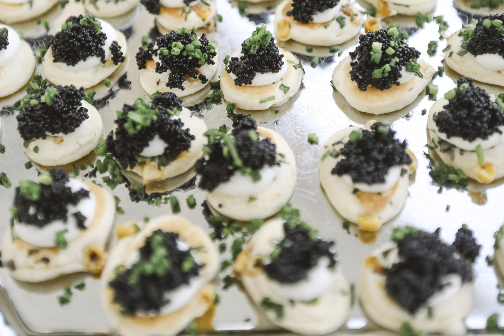 Fine dining wedding food with caviar and creme fraiche blinis