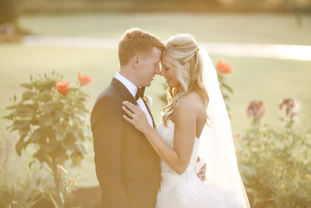 luxury wedding portraits at private estate at sunset during golden hour in designer vera wang gown