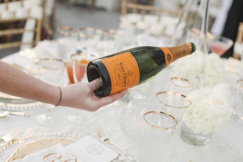 luxury wedding with veuve cliquot champage for wedding guests at luxury wedding reception
